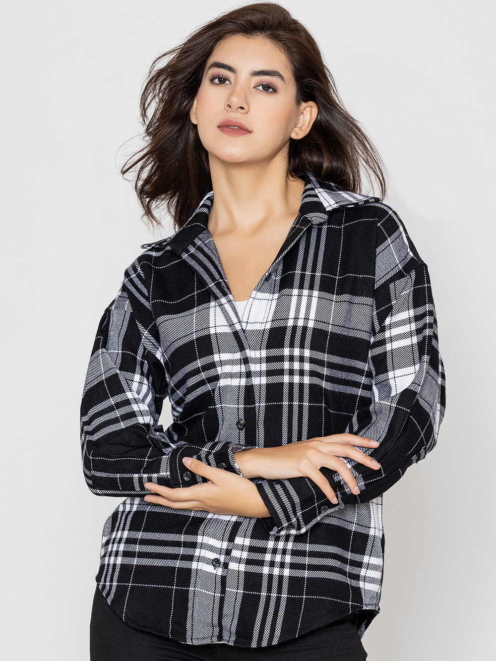 Black and white tartan plaid shirt with spread collar and buttoned cuffs