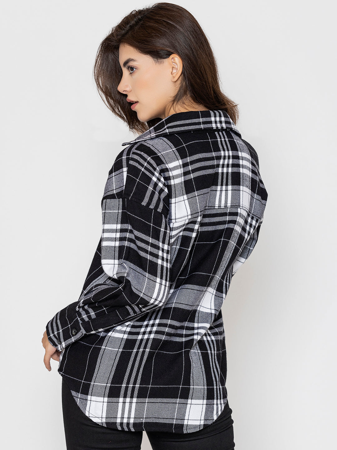 Black and white tartan check shirt close-up of acrylic fabric