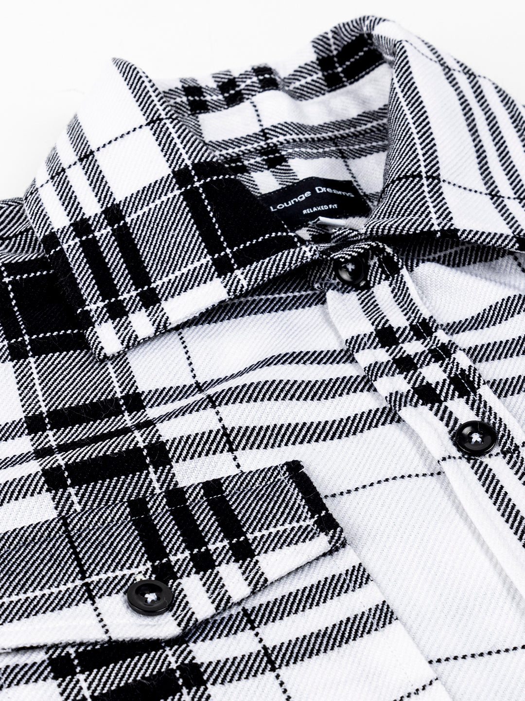 White and black tartan shacket styled with denim trousers