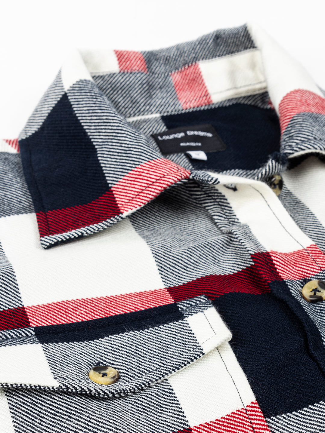 Navy and red tartan shacket styled with denim trousers