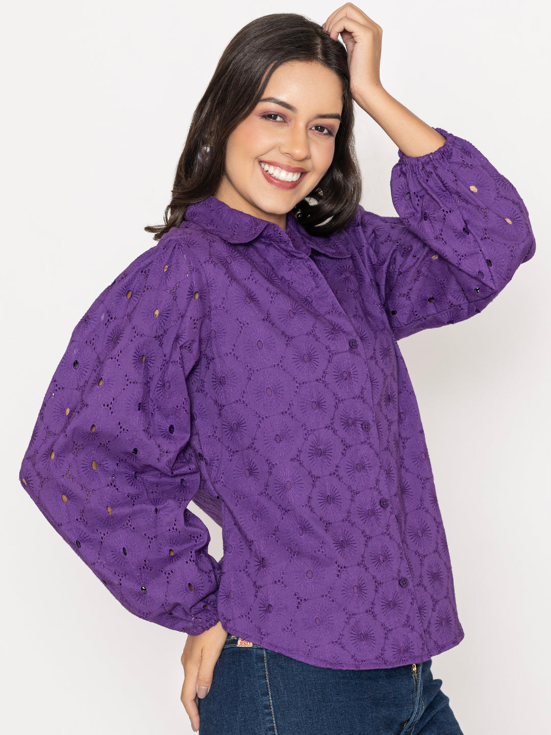 Close-up of Schiffli embroidery on purple cotton shirt