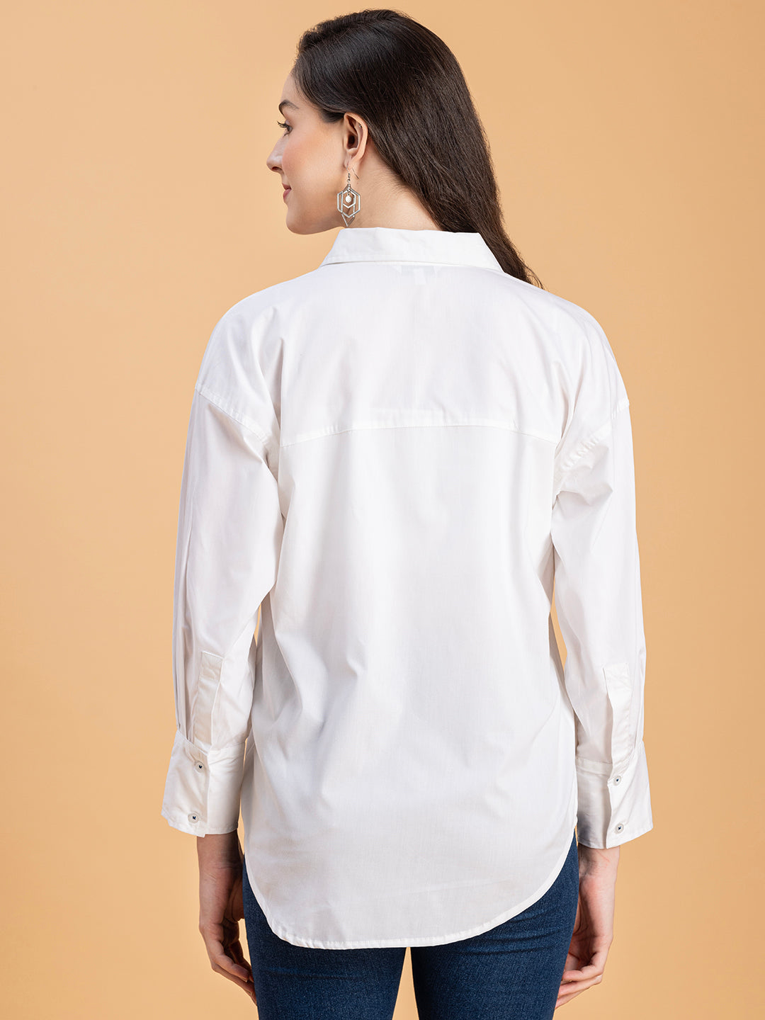Lifestyle shot of white cotton oversized shirt