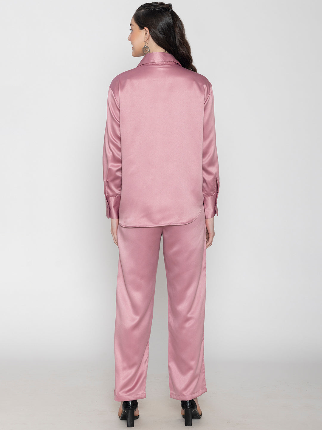 Lifestyle shot of woman in light pink satin co-ord