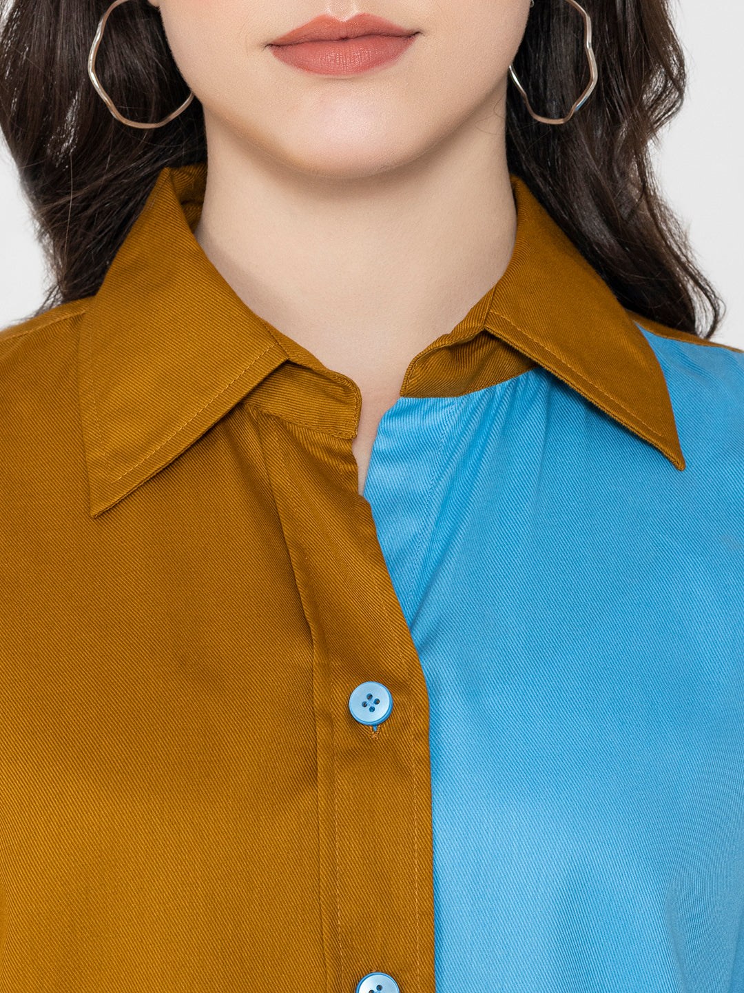 Close-up of brown and sky blue colorblock detail
