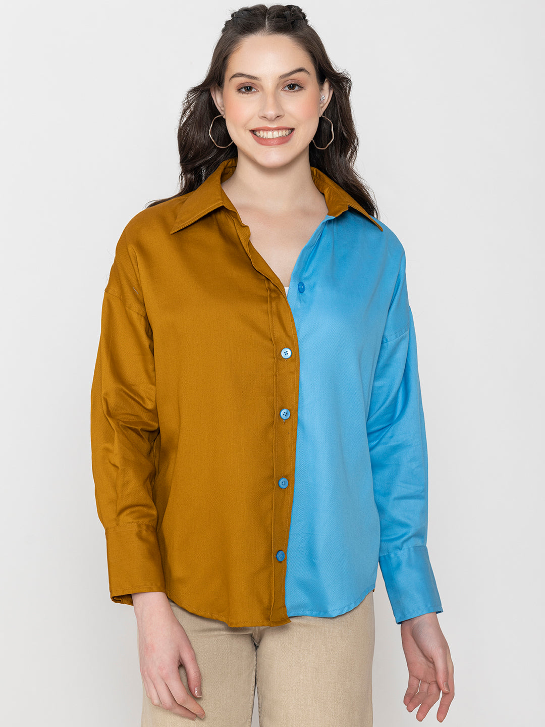 Detail of curved hemline on colorblock shirt