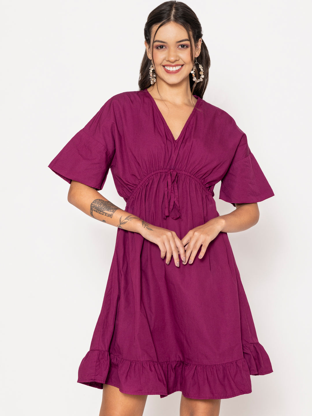Close-up of V-neckline on wine cotton dress