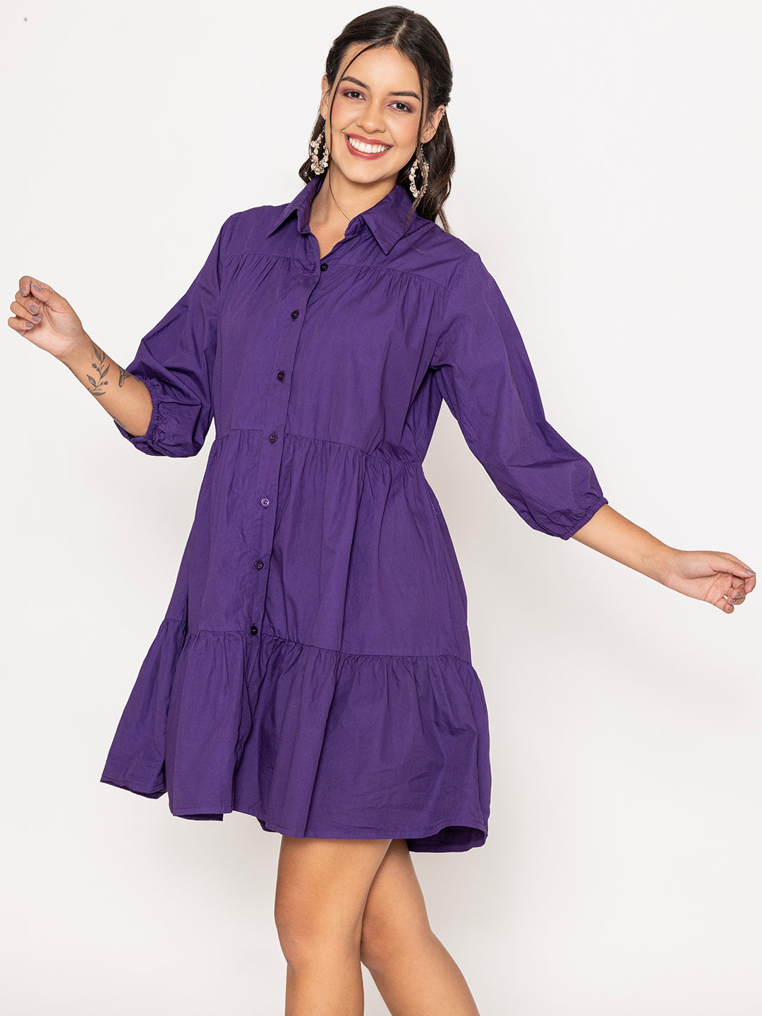 Button placket detail on purple cotton shirt dress