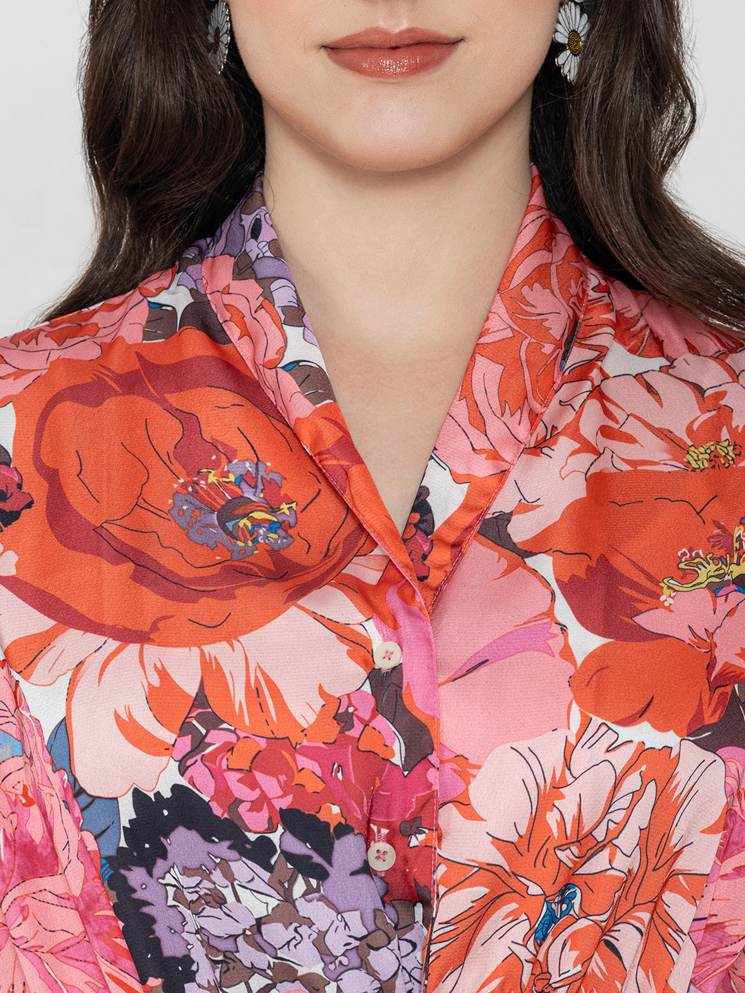 Close-up of pink floral print on lustrous satin fabric