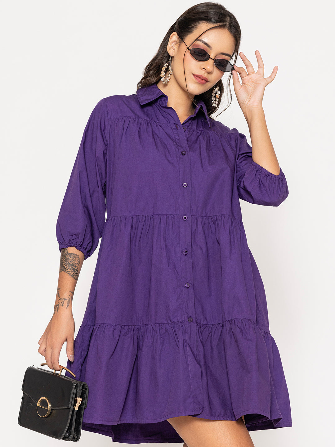 Lifestyle shot of woman wearing purple cotton shirt dress