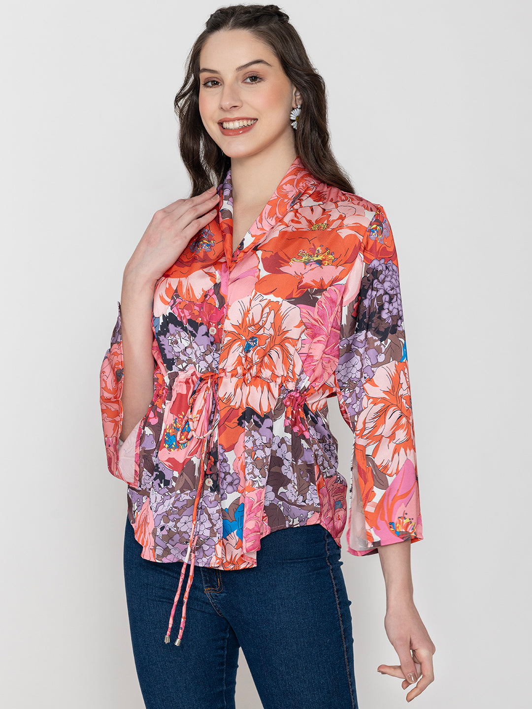 Detail of shirt collar and button placket on pink satin top