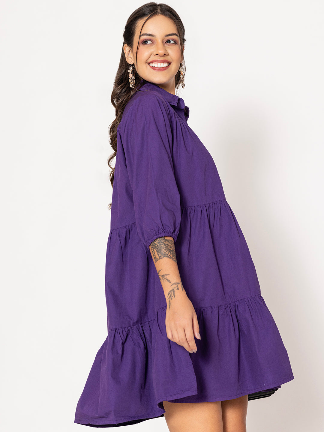 Detail of cotton fabric on purple shirt dress