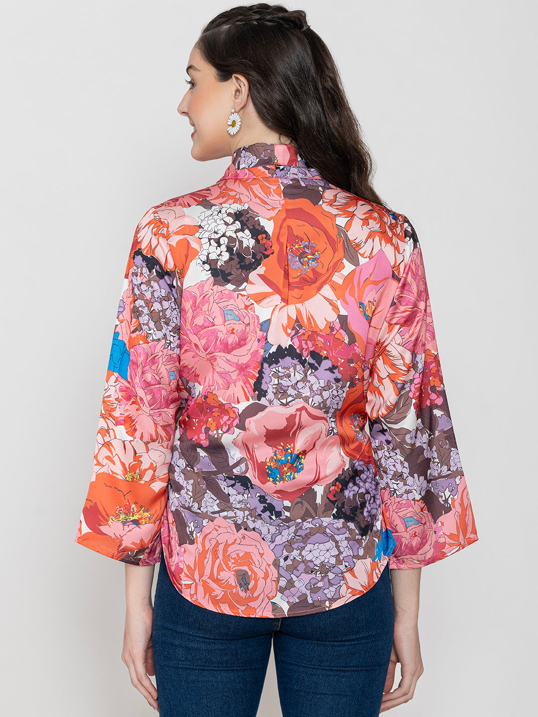 Lifestyle shot of model wearing pink floral satin top