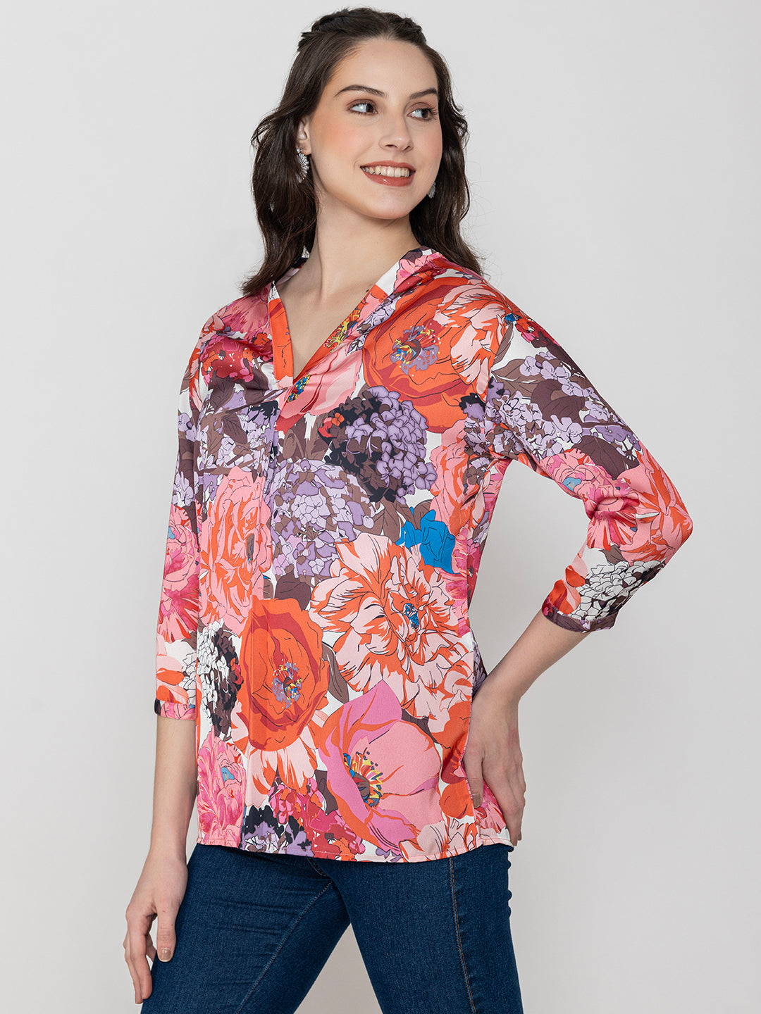 Detail shot of v-neck on pink floral satin top