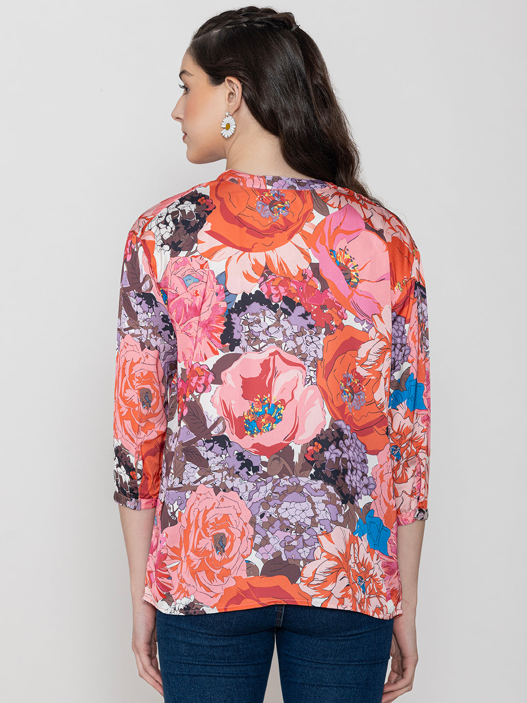 Lifestyle shot of pink floral satin top styled
