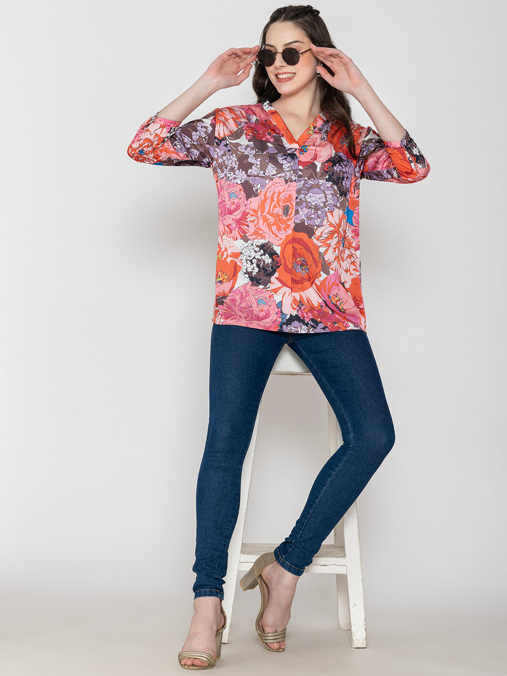 Side view of pink floral satin top
