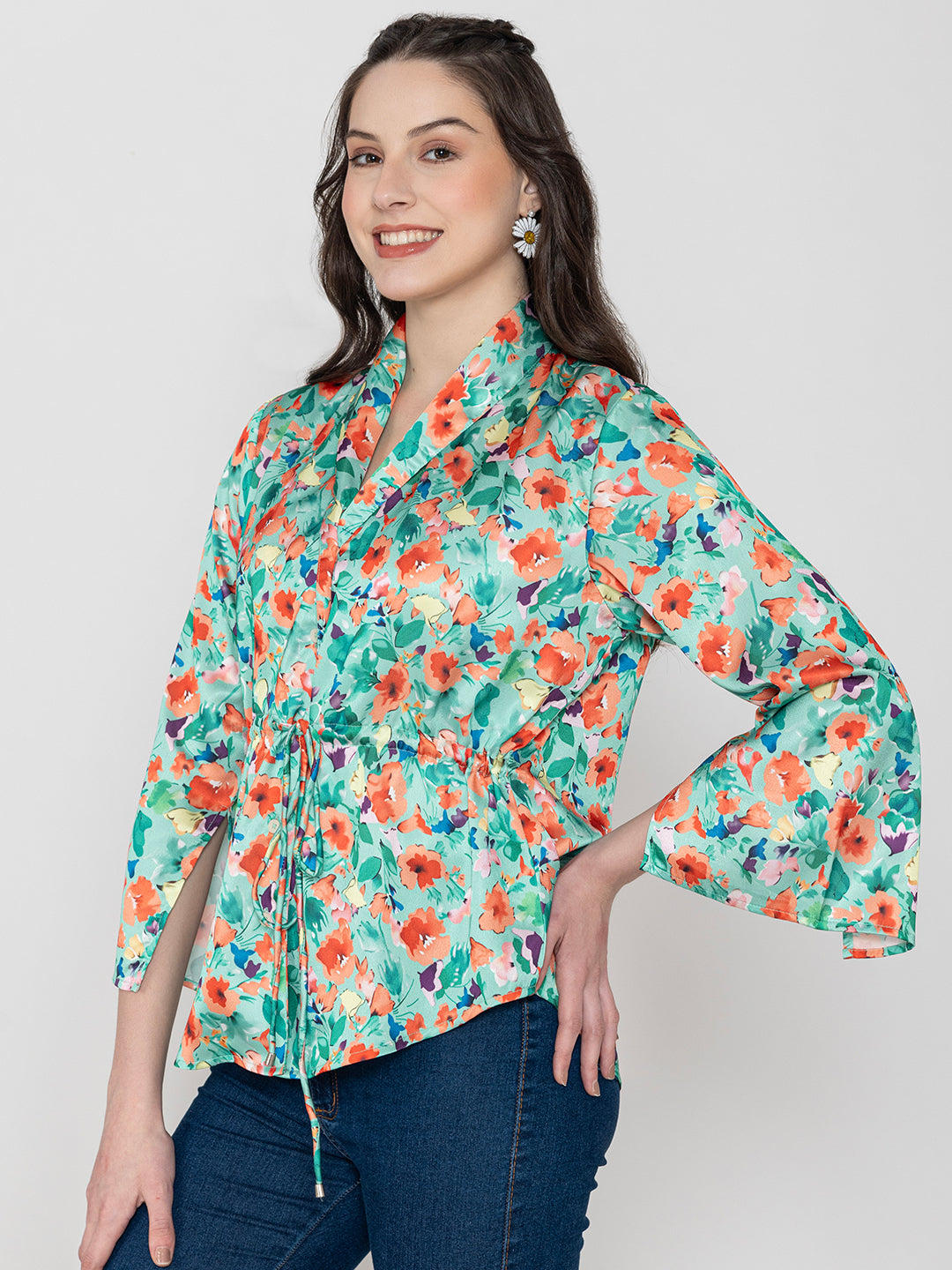 Detail shot of shirt collar on green satin top