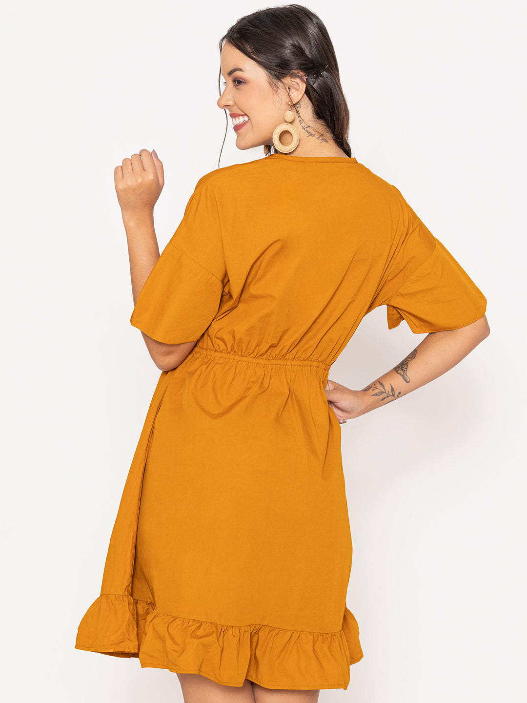 Detail of cotton fabric on tan brown dress