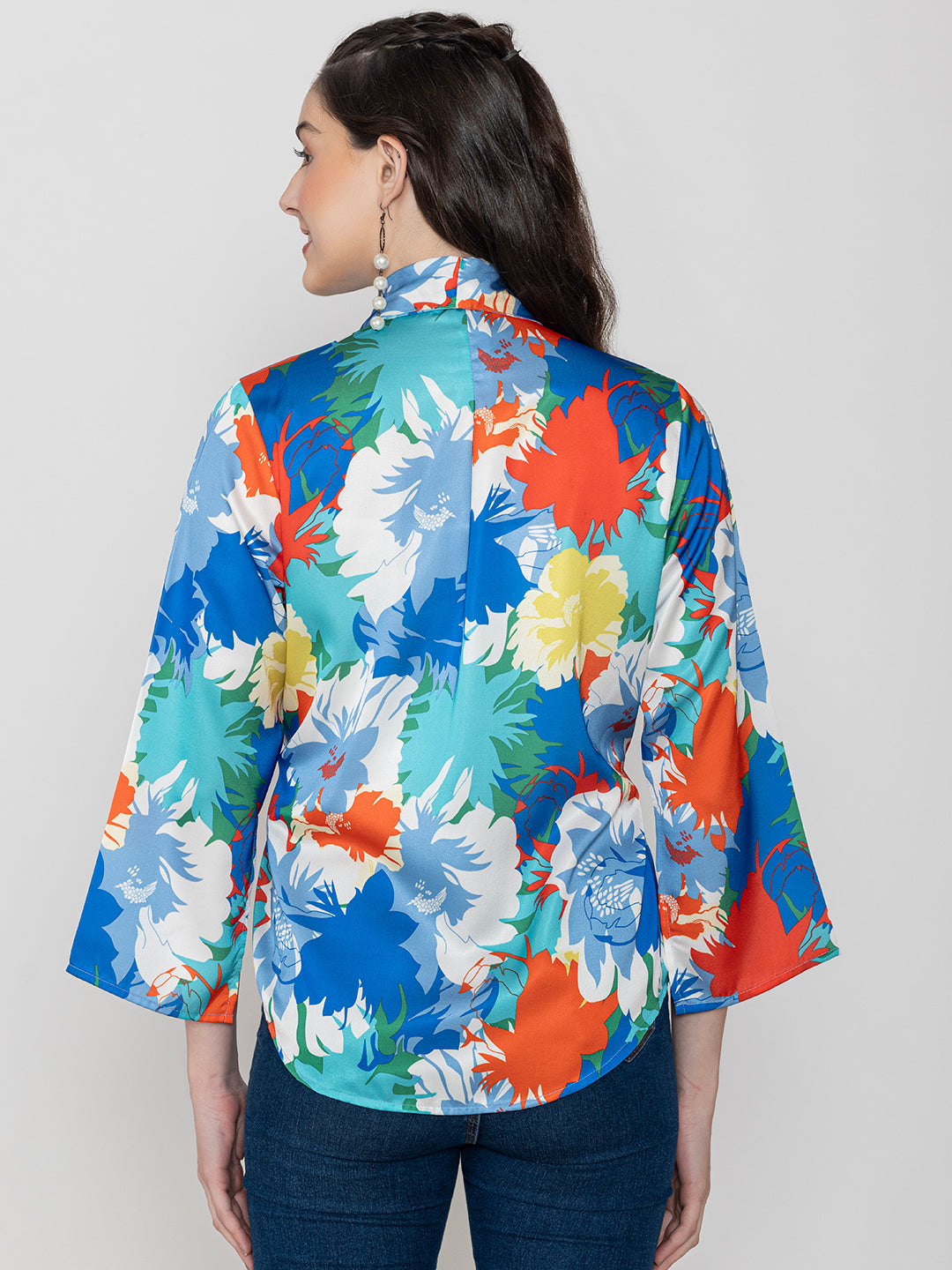 Close-up of blue floral print satin fabric