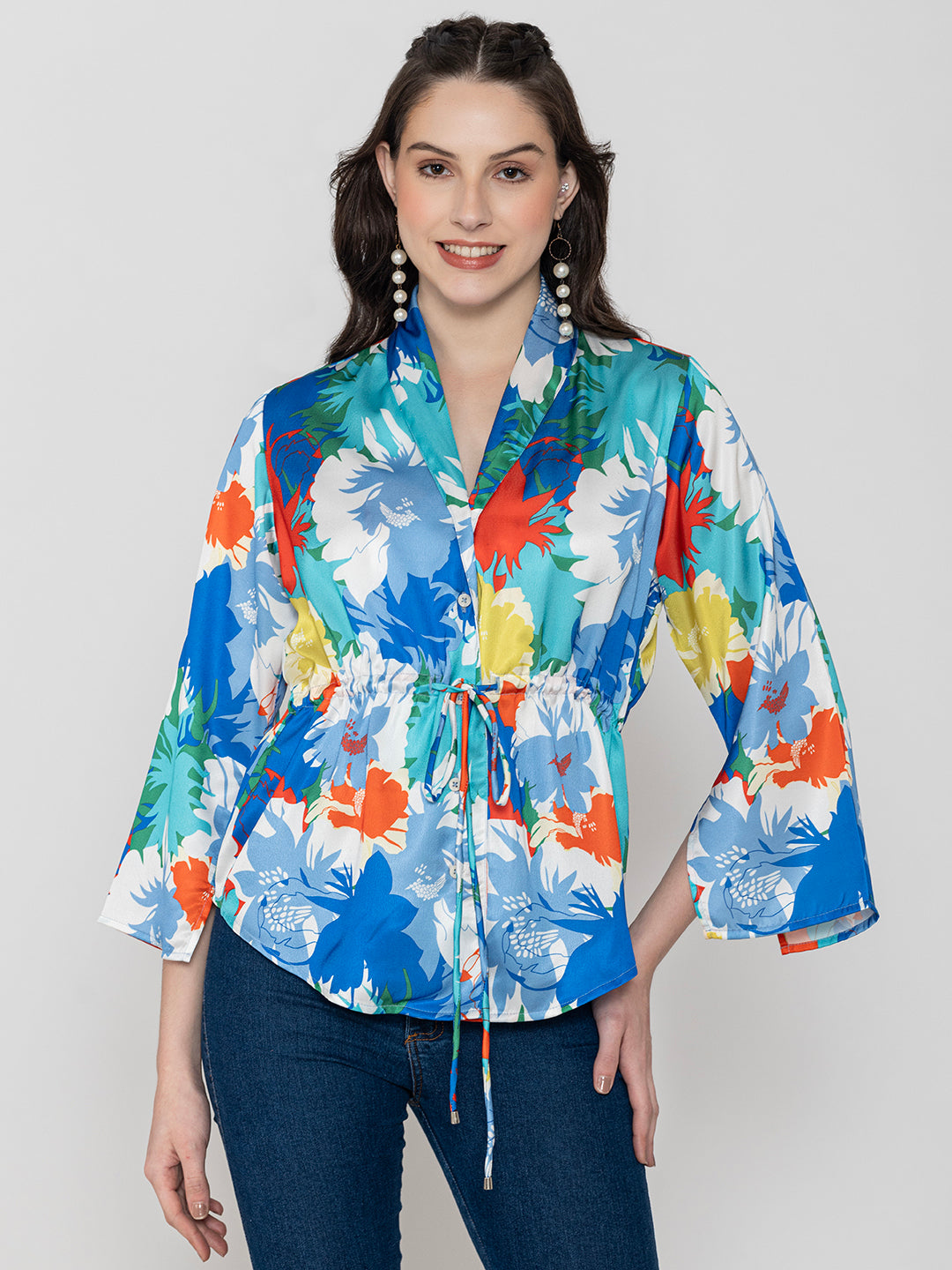 Detail shot of shirt collar on blue satin top