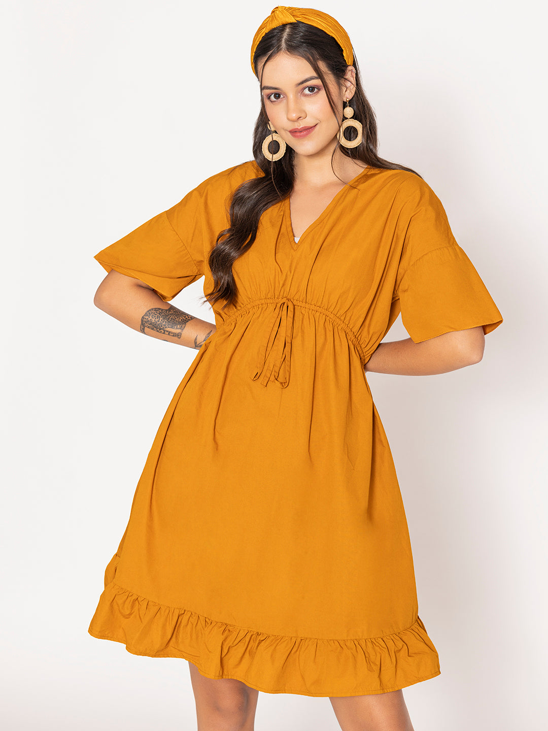 Side view of tan brown cotton dress