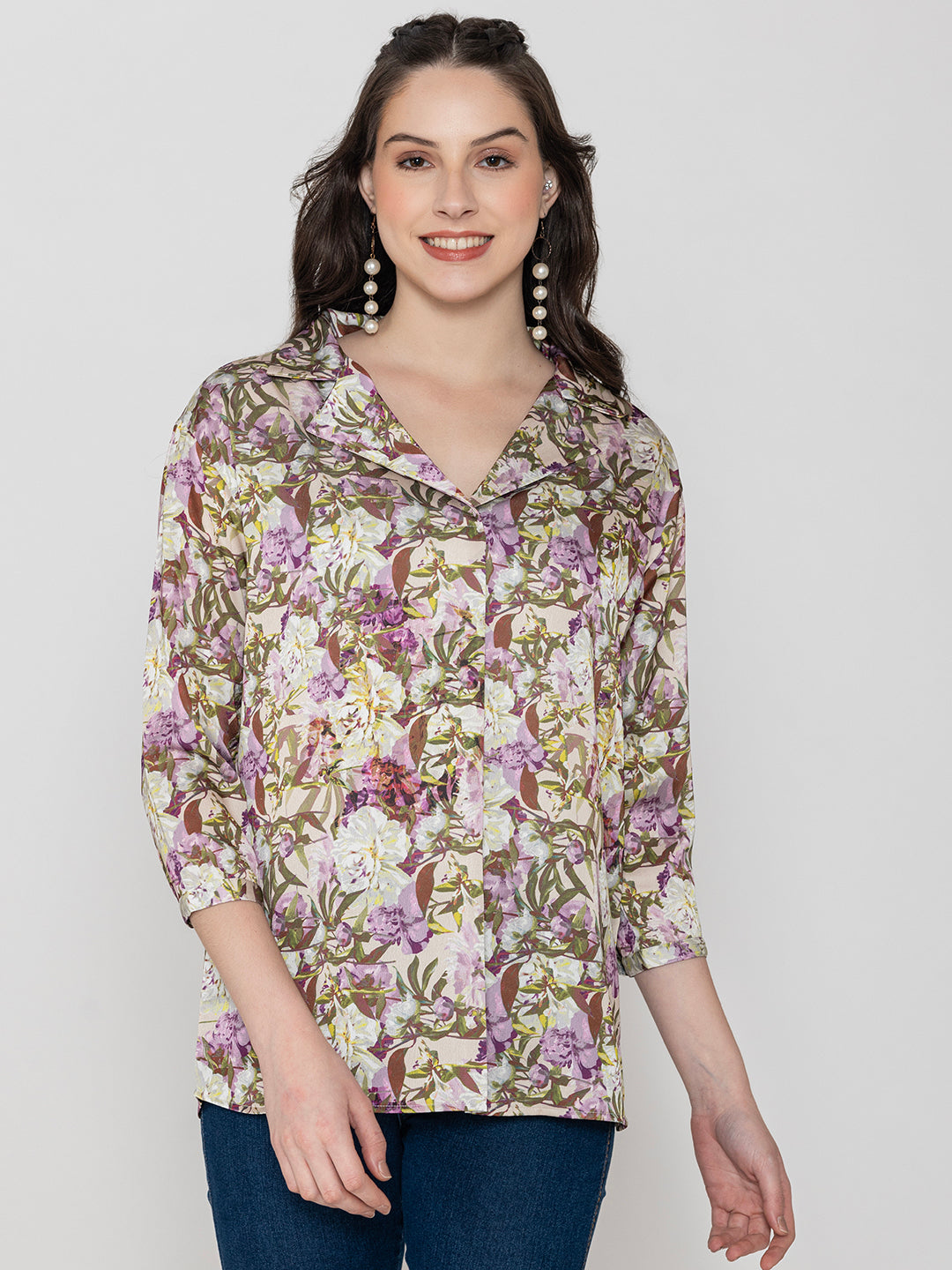 Close-up of purple floral print satin fabric