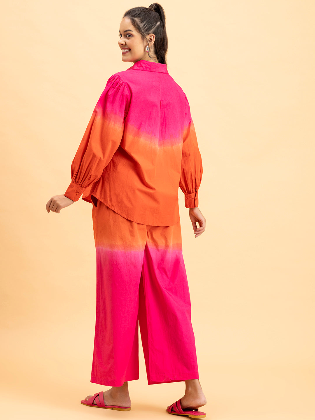 Lifestyle shot of model in pink orange ombre co-ord set
