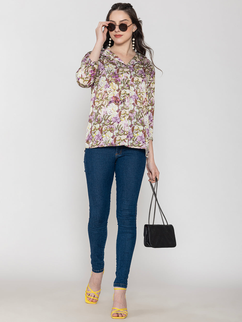 Side view of purple floral satin top with long buttoned cuffs