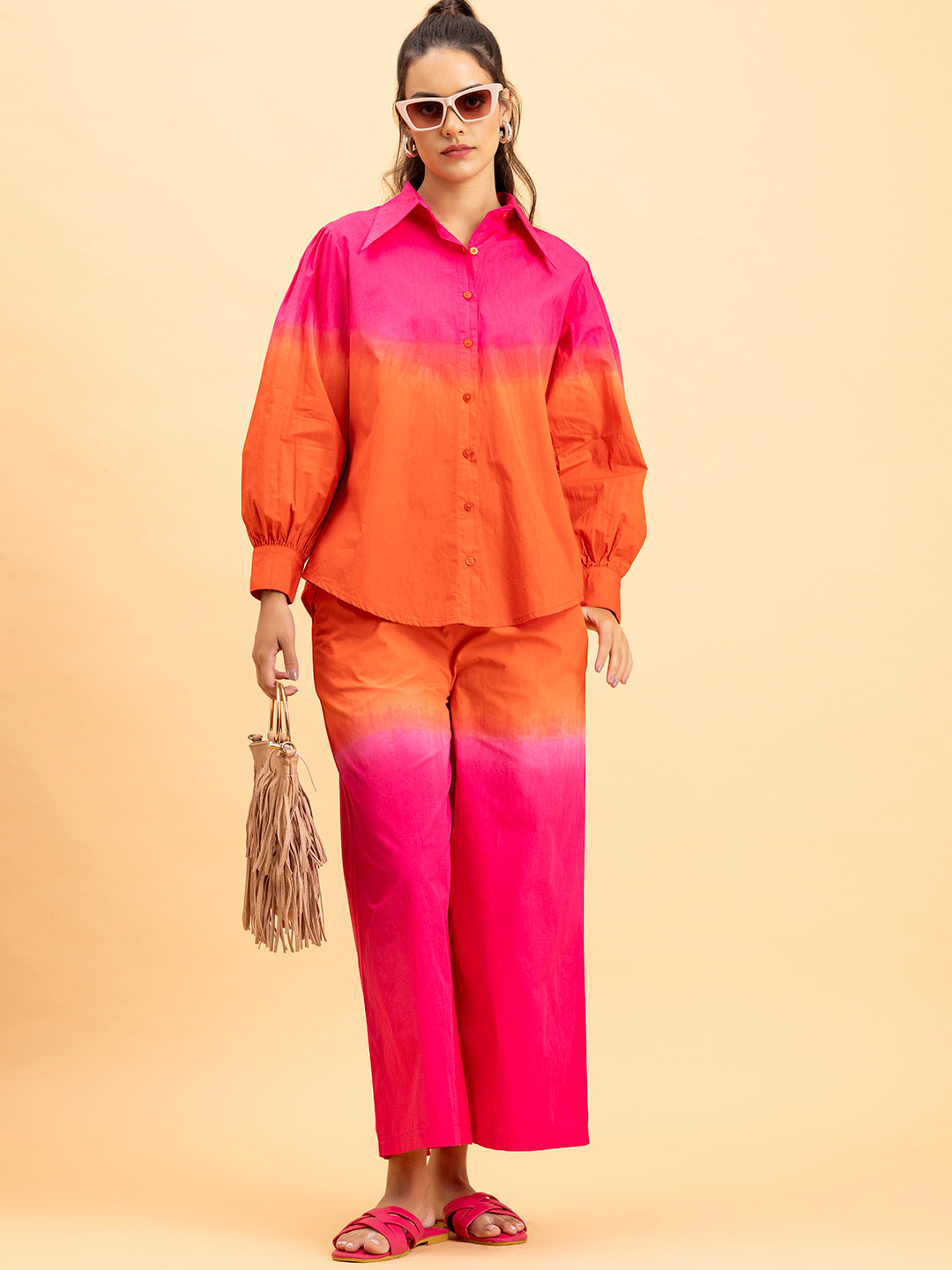 Close-up of tie-dye gradient on pink orange cotton fabric