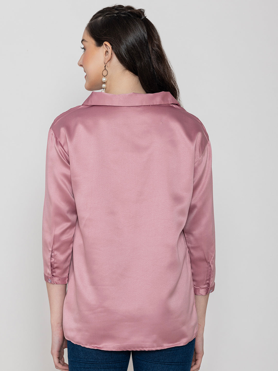 Close-up of light pink satin fabric