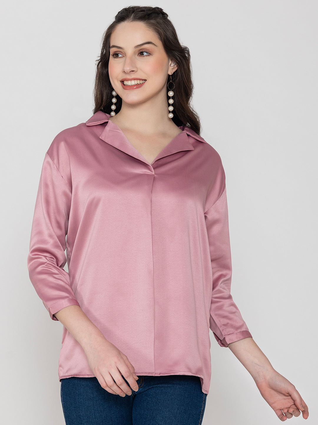 Detail shot of shirt collar on light pink satin top
