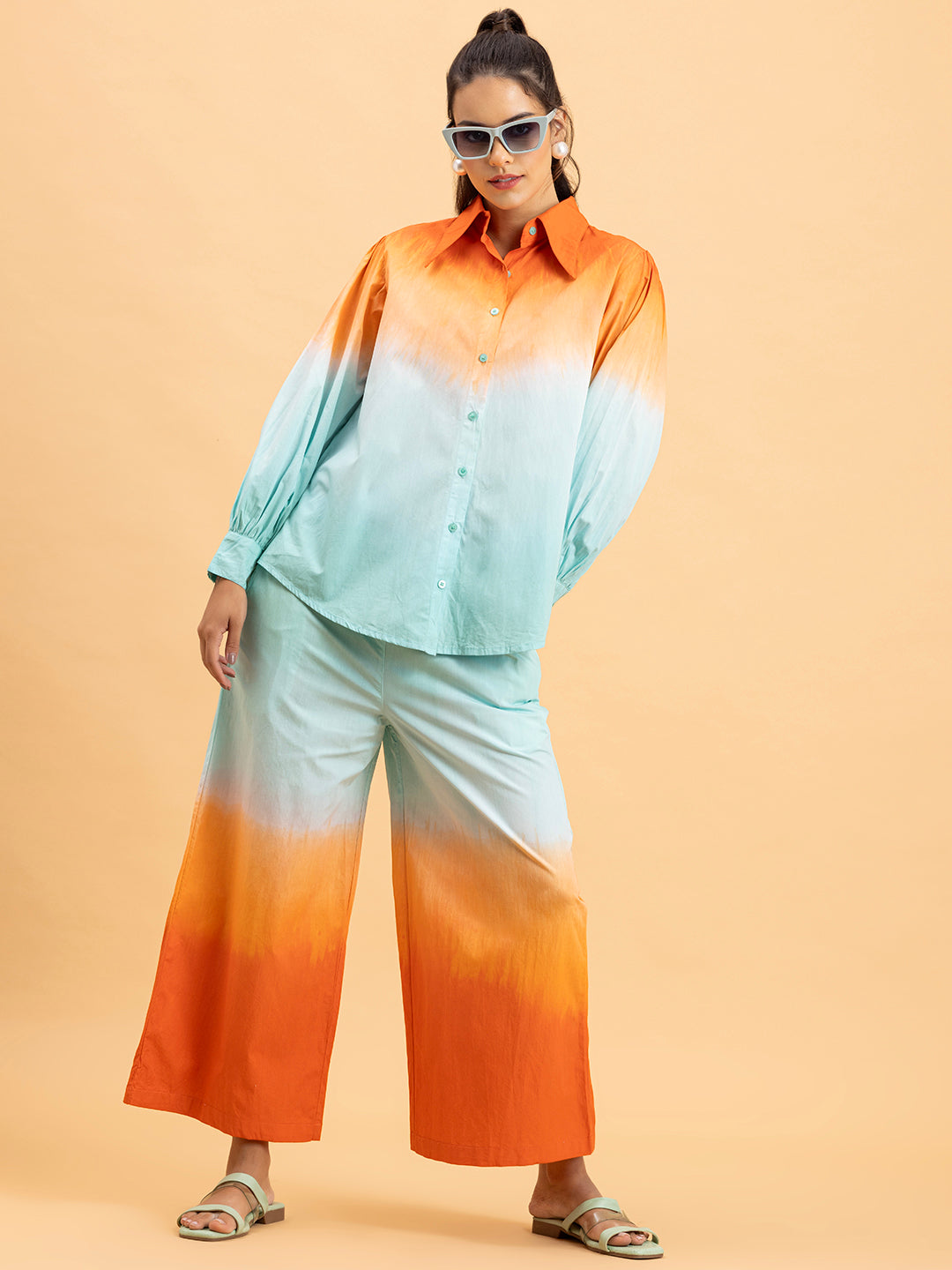 Close-up of tie-dye gradient on orange blue cotton fabric