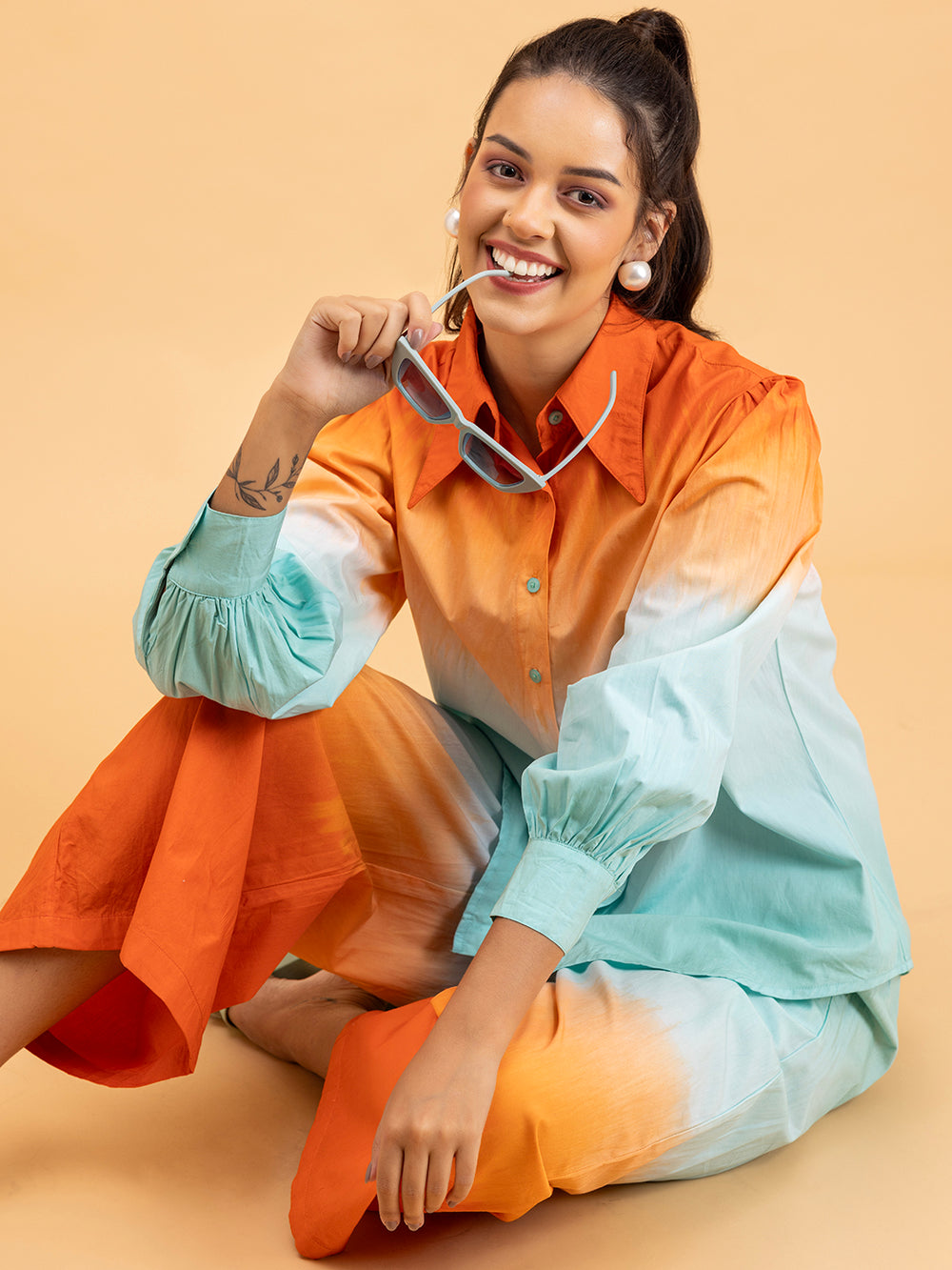 Side angle of orange blue ombre cotton co-ord on model
