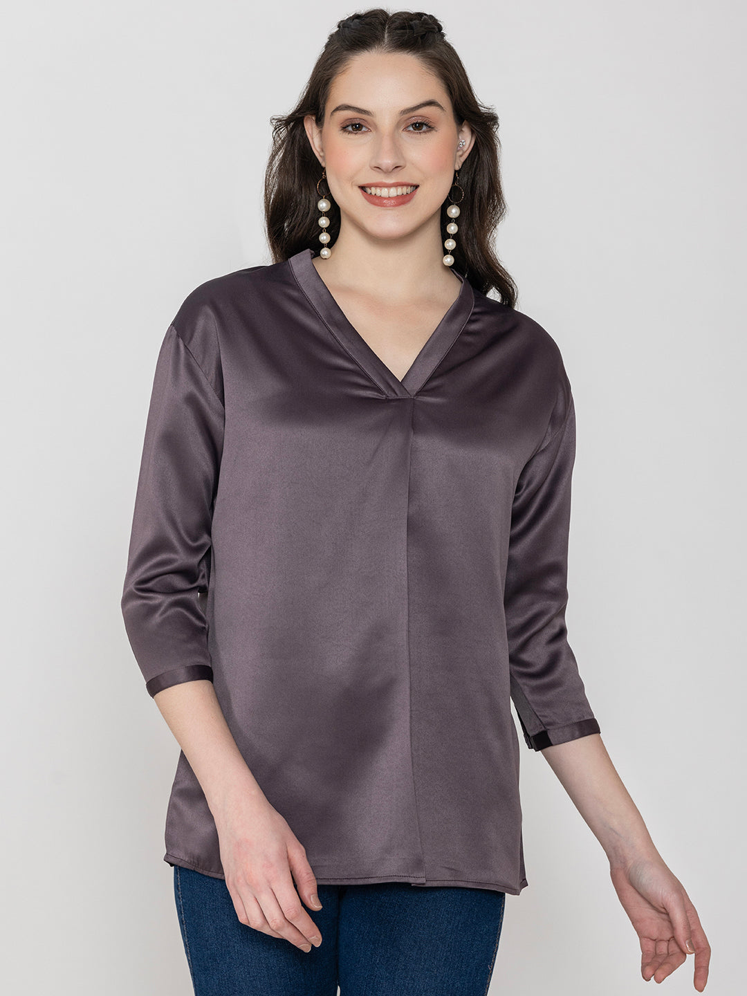 Detail shot of v-neck on steel grey satin top