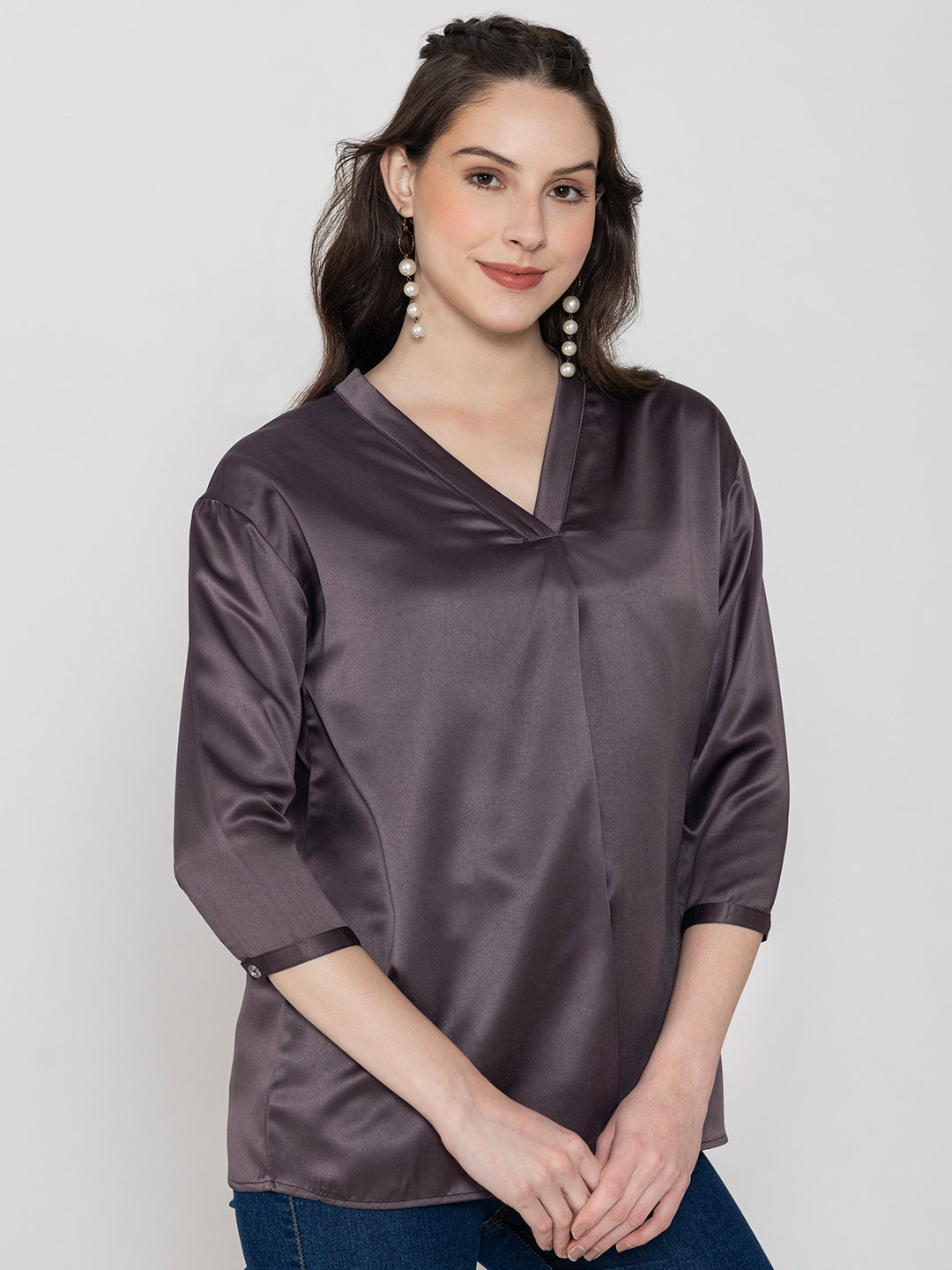 Lifestyle shot of steel grey satin top styled