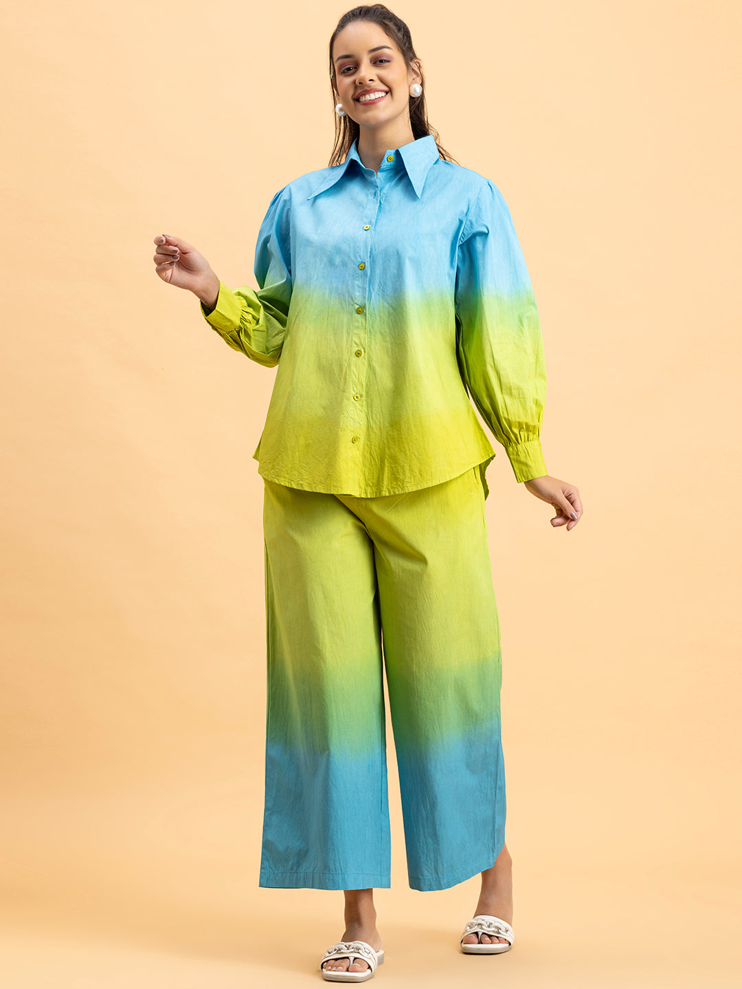 Lifestyle shot of model wearing blue green ombre co-ord set