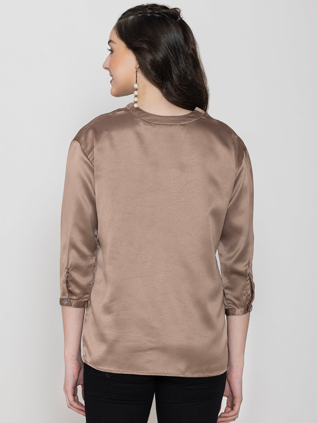 Side view of beige satin top styling
