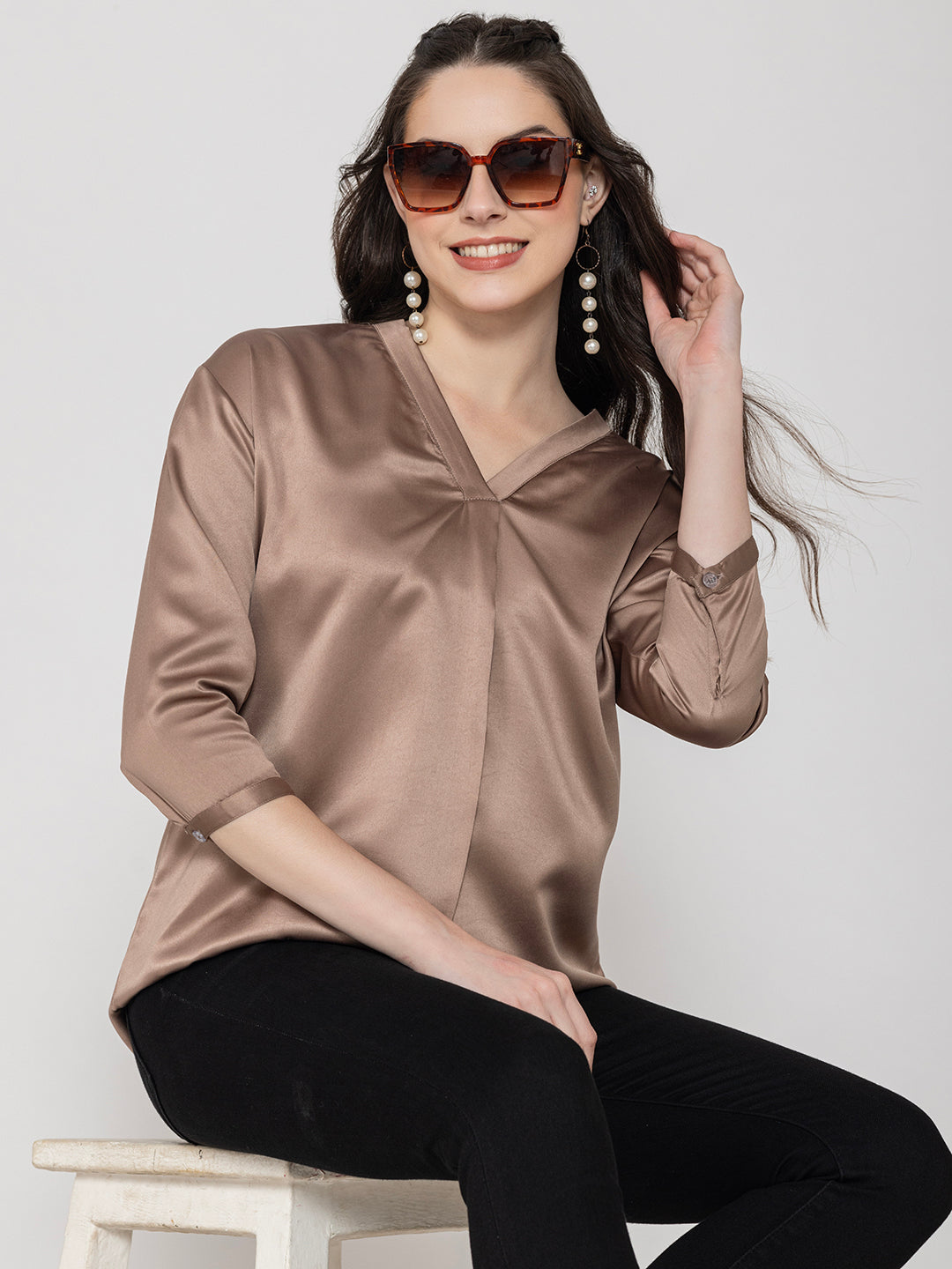 Model wearing beige satin V-neck top for women