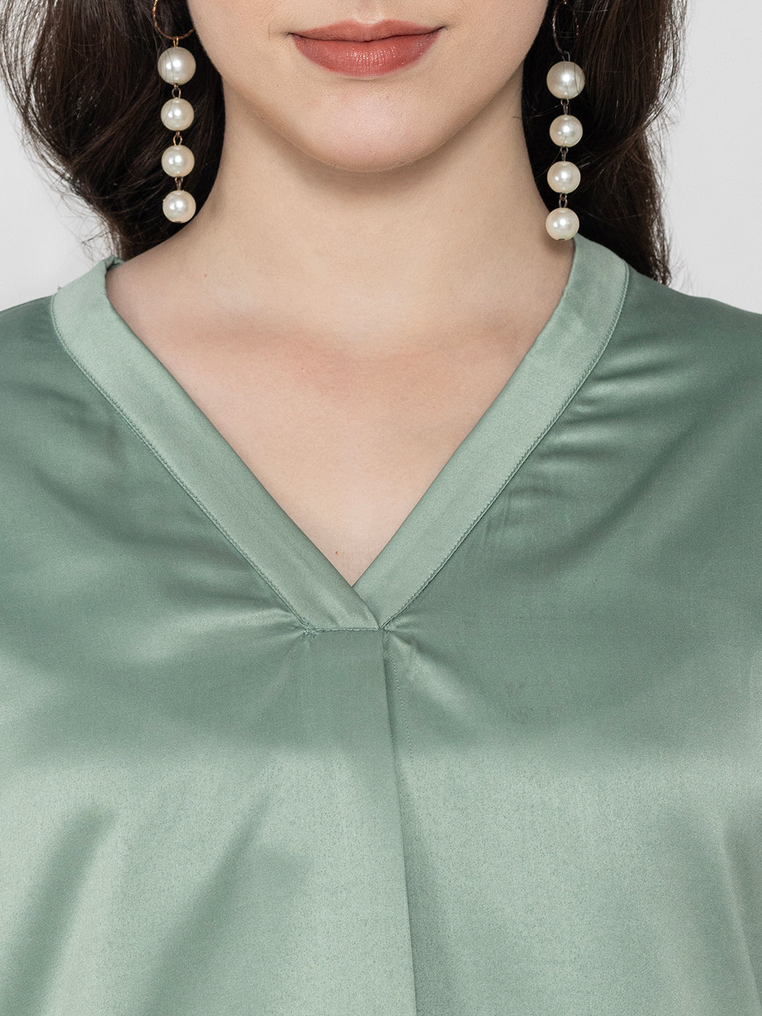 Back view of light green satin top