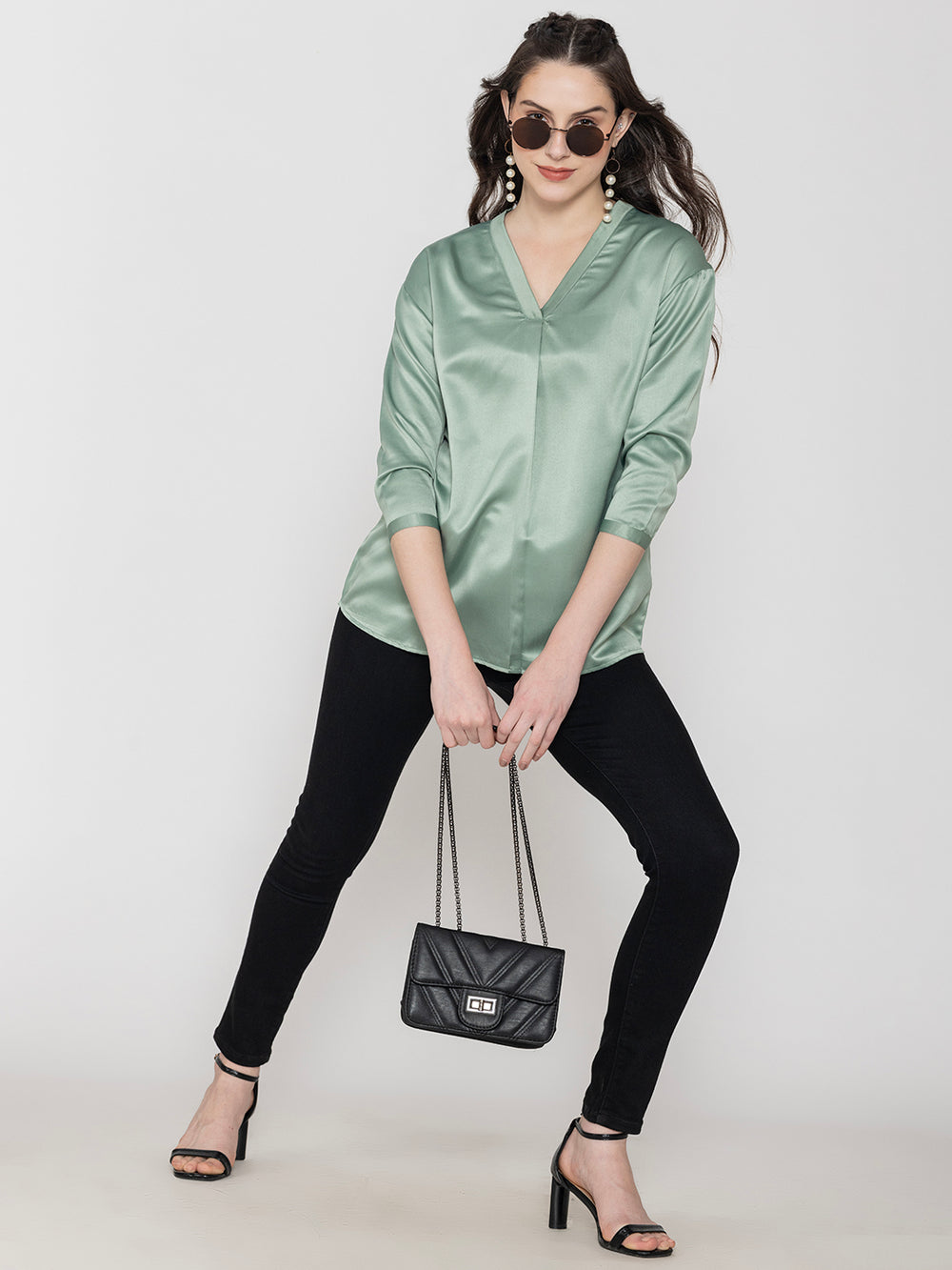 Side view of light green satin top