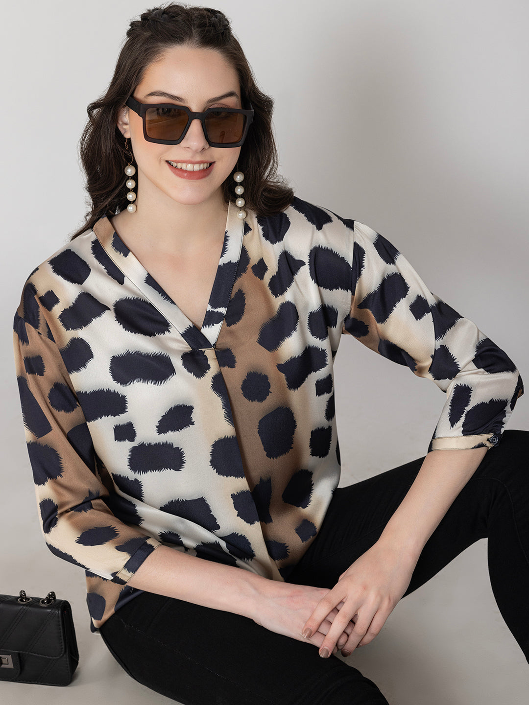 Front view of beige animal print satin v-neck top