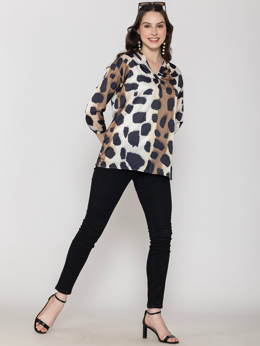 Full outfit view of beige animal print satin top