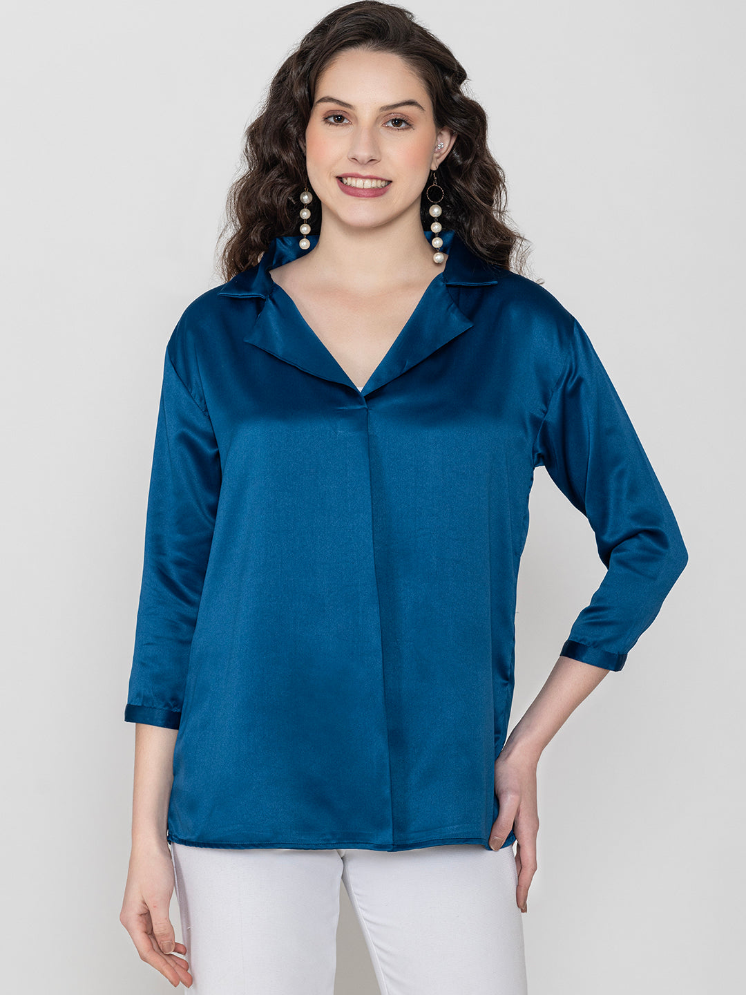 Detail shot of shirt collar on navy satin top