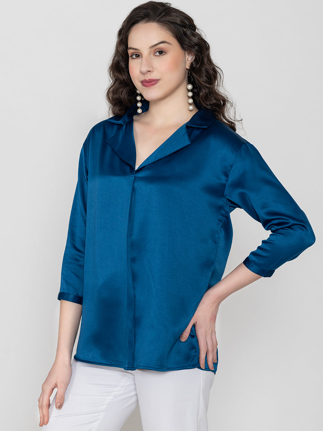Lifestyle shot of navy blue satin top styled