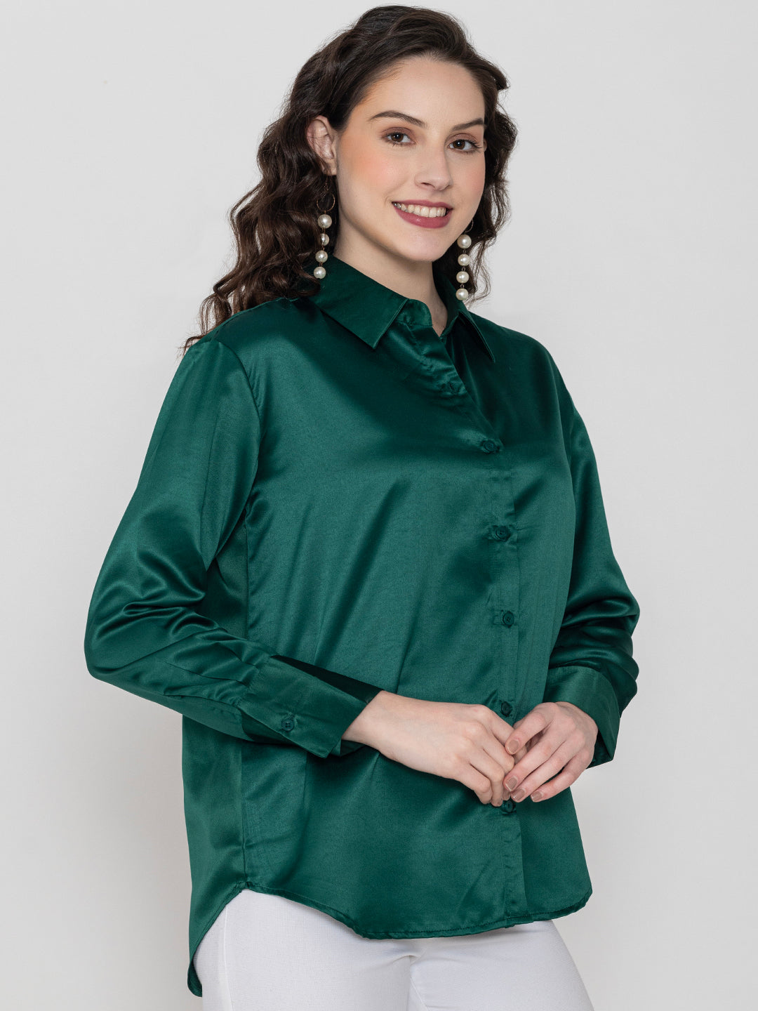 Lifestyle shot of woman in dark green satin shirt