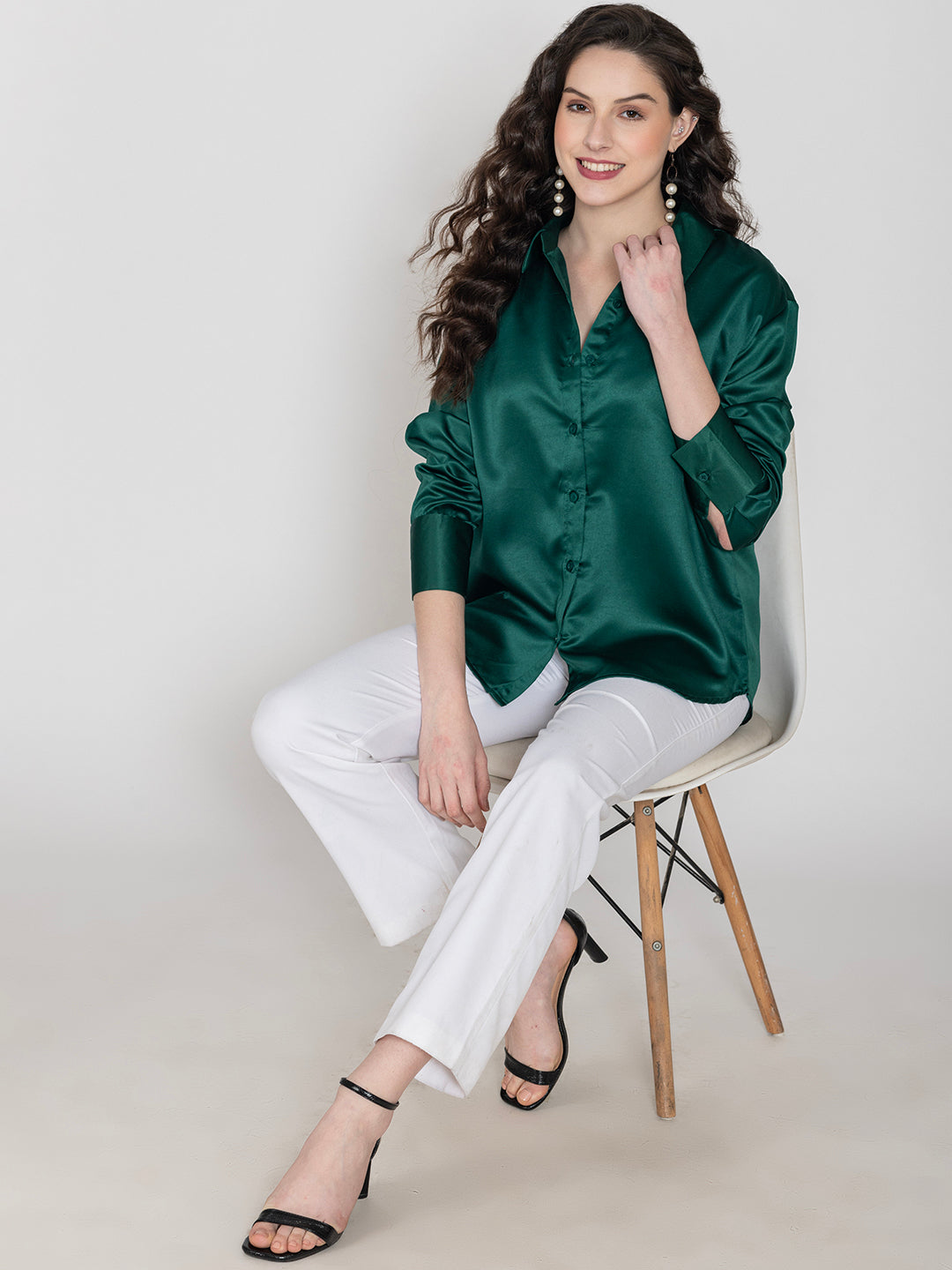 Front view of dark green satin shirt with spread collar