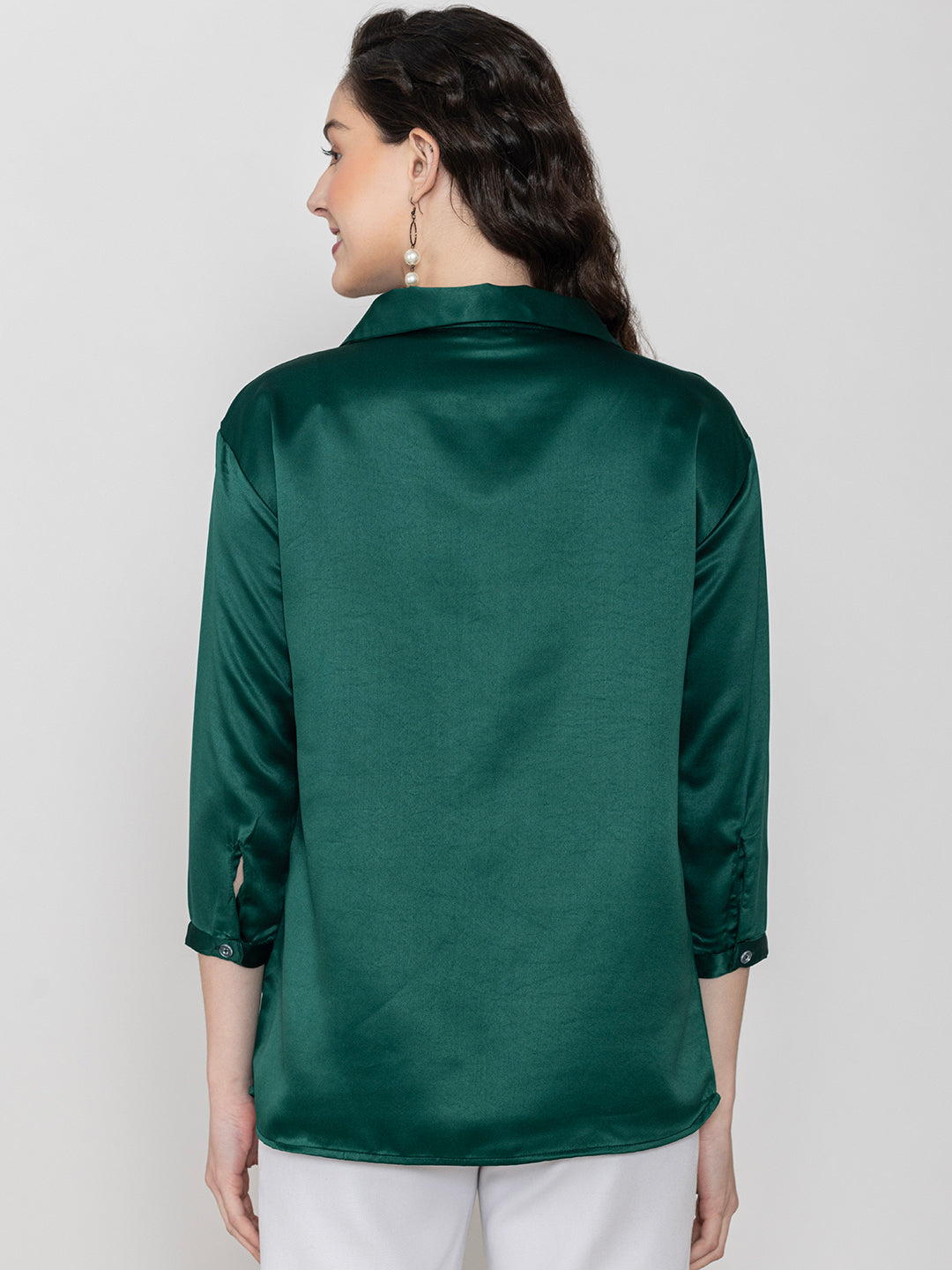Close-up of dark green satin fabric
