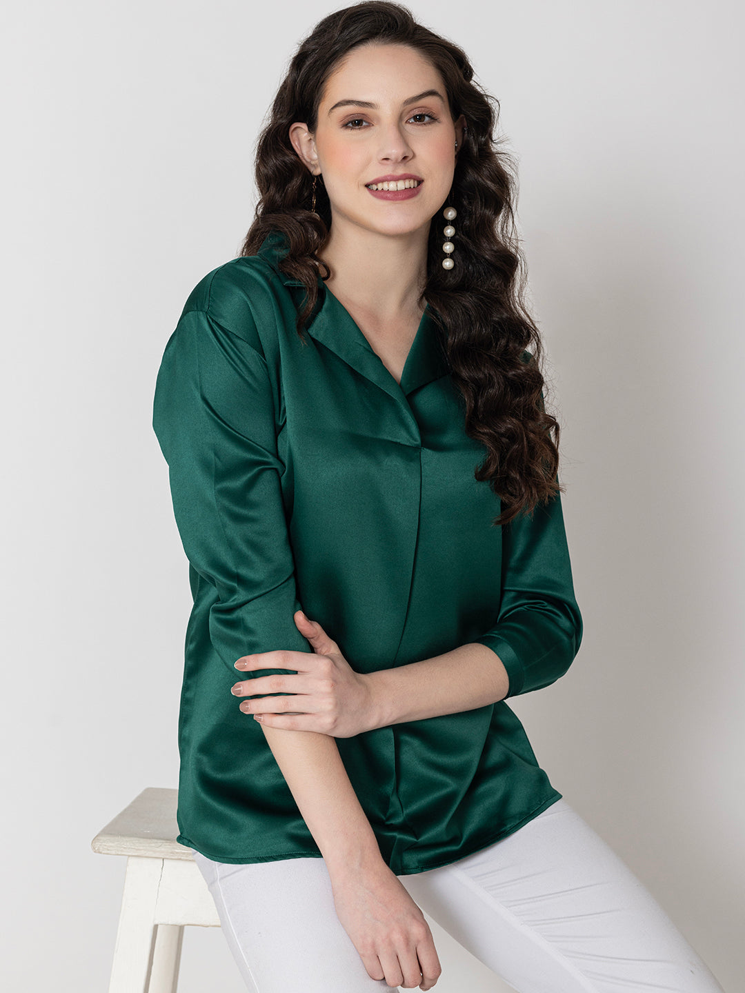 Full outfit view of dark green satin top