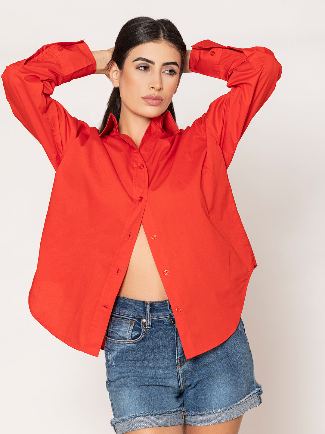 Back view of red cotton oversized shirt with curved hem