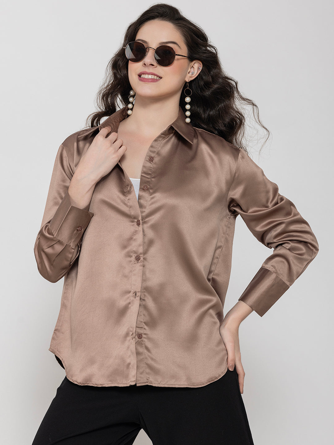 Lifestyle shot of woman in beige satin shirt