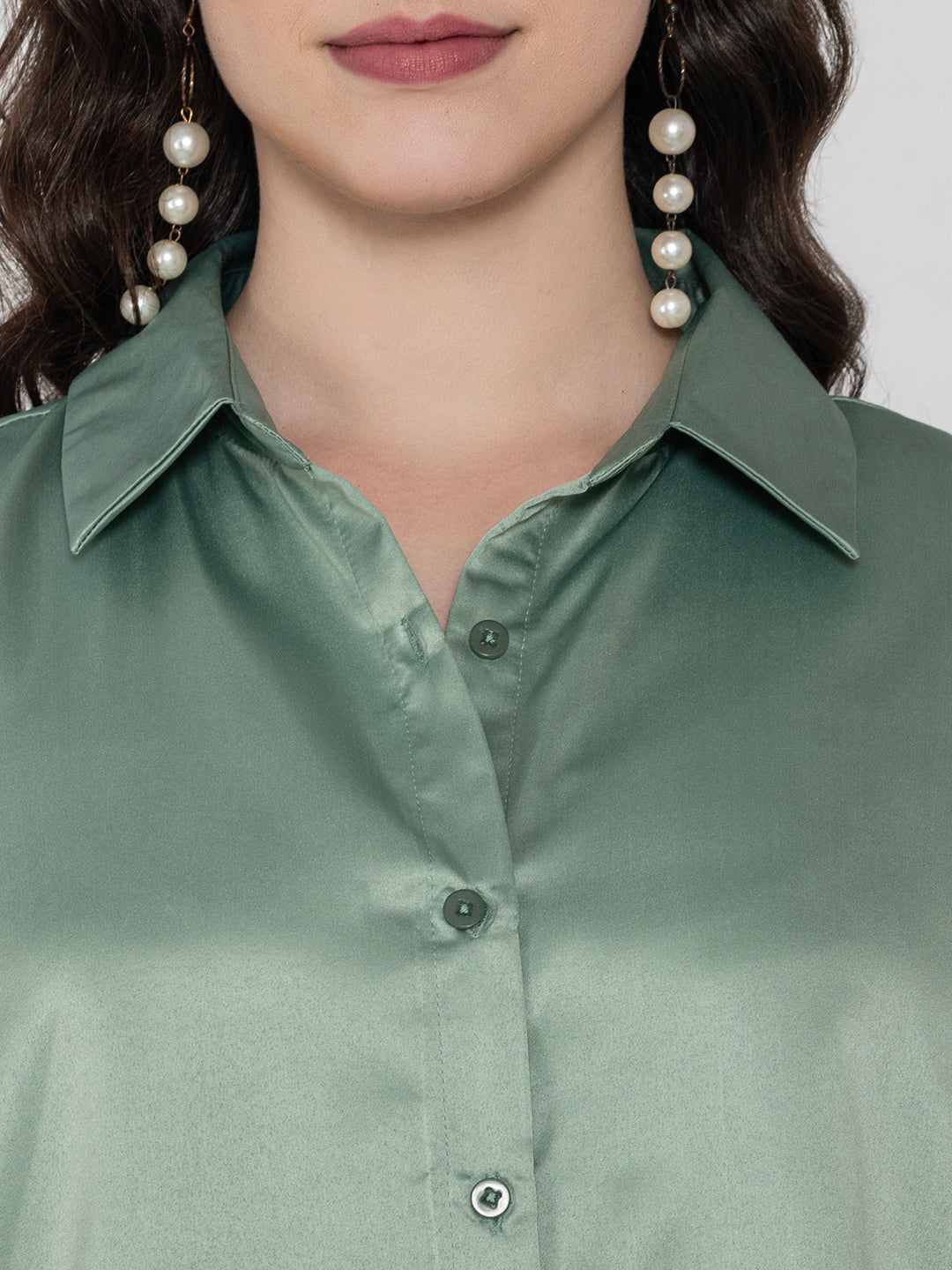 Close-up of light green satin fabric